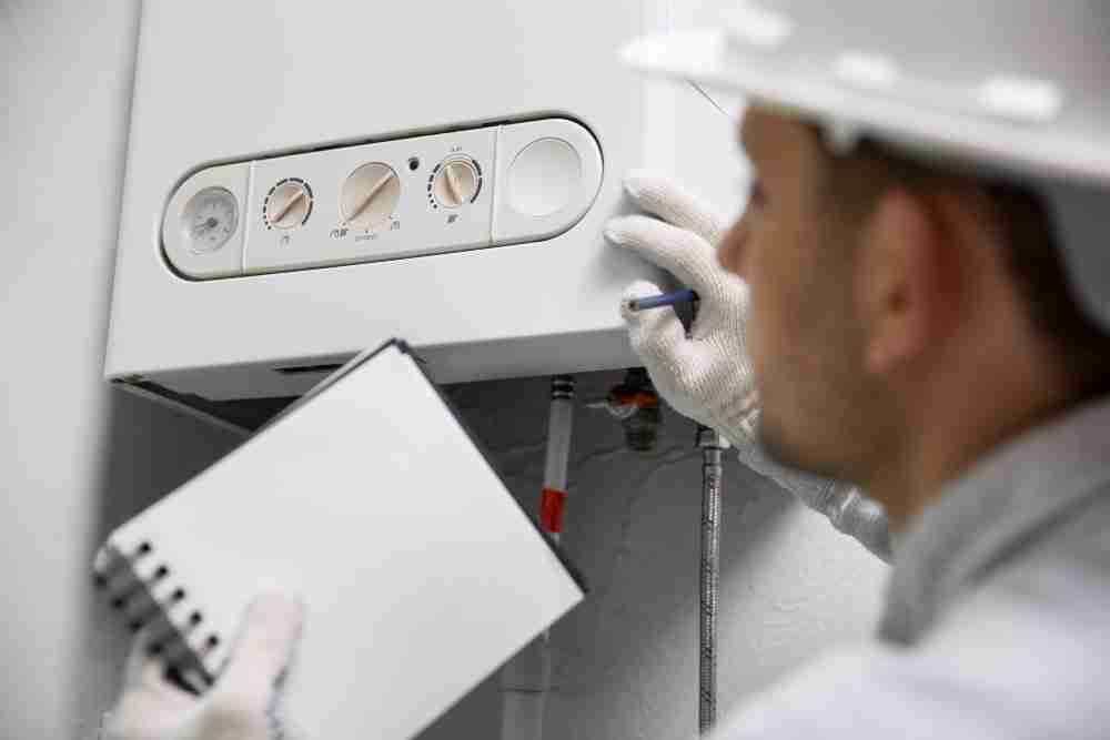 worker repairing water heater