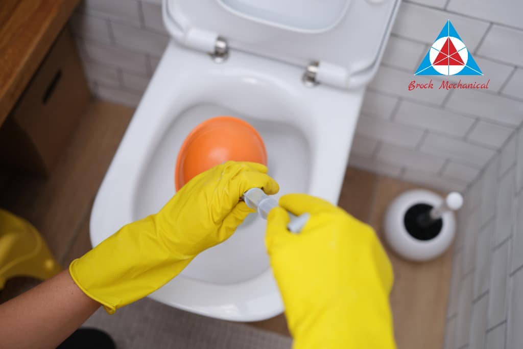 plumber cleaning drain commerce township