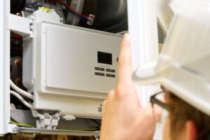 technician troubleshooting a gas furnace