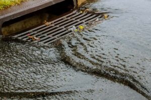 water gushing from storm drain