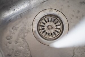 water pouring from a faucet tap